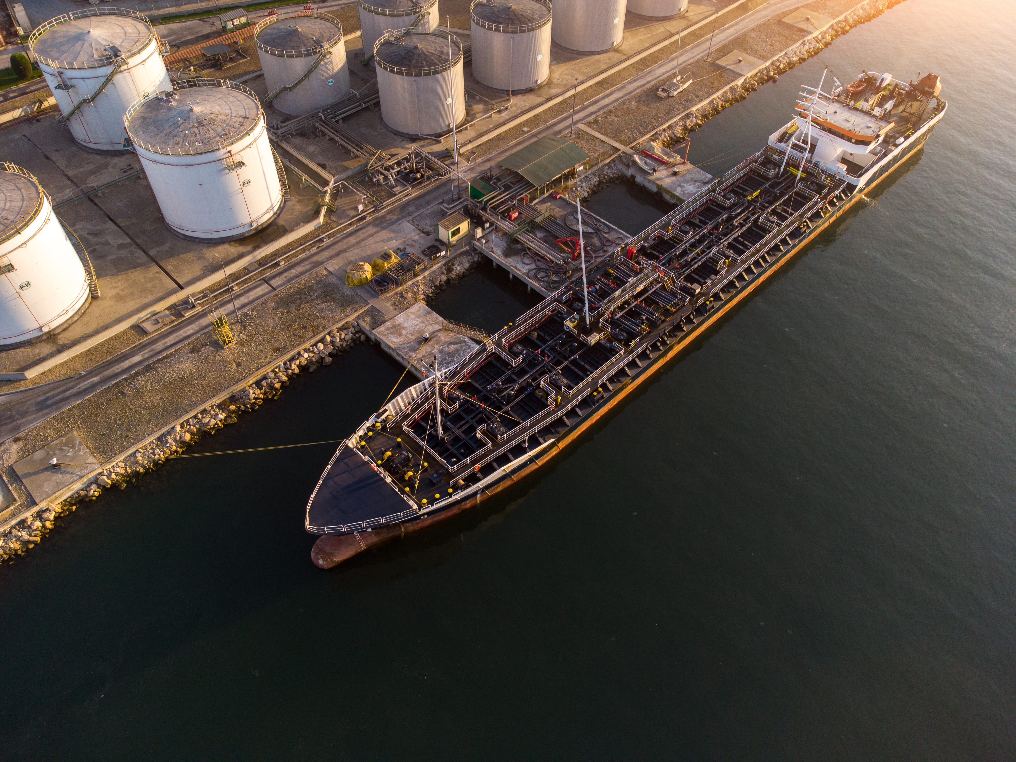 Aerial view of a tanker loading at a bulk liquid storage terminal